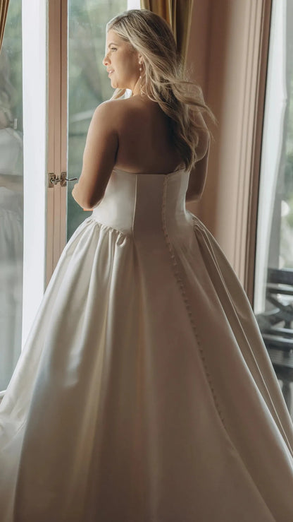 Strapless Mikado A-Line Wedding Gown with Architectural Seaming and Pockets Stella York SY8274